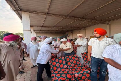 MLA Kulwant Singh interacting with residents during a community meeting in Bahrampur village, SAS Nagar Mohali, discussing development works and public welfare initiatives