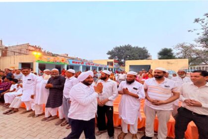 MLA Kulwant Singh interacting with residents during a community meeting in Jujhar Nagar, SAS Nagar Mohali, highlighting development initiatives and screening a documentary on Sri Guru Ravidas Ji.