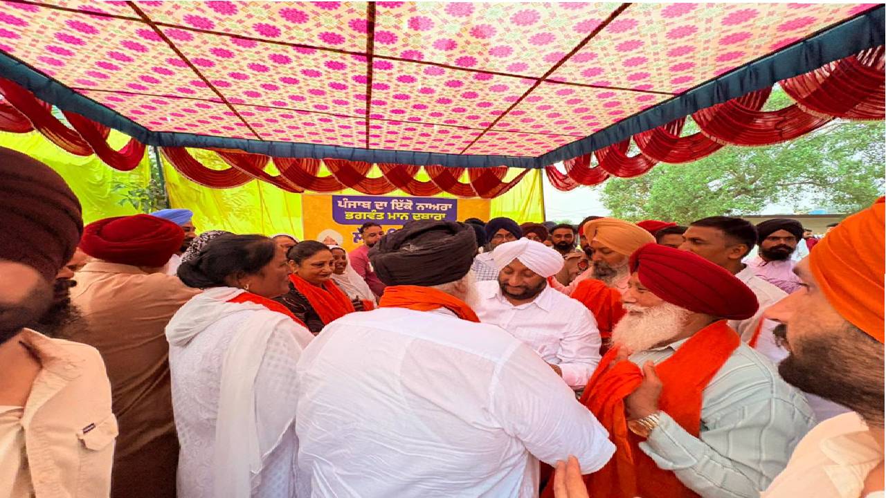 MLA Kulwant Singh interacting with residents during a Lok Milni programme in Barmajra village, SAS Nagar Mohali, and screening a documentary on Sri Guru Ravidas Ji.