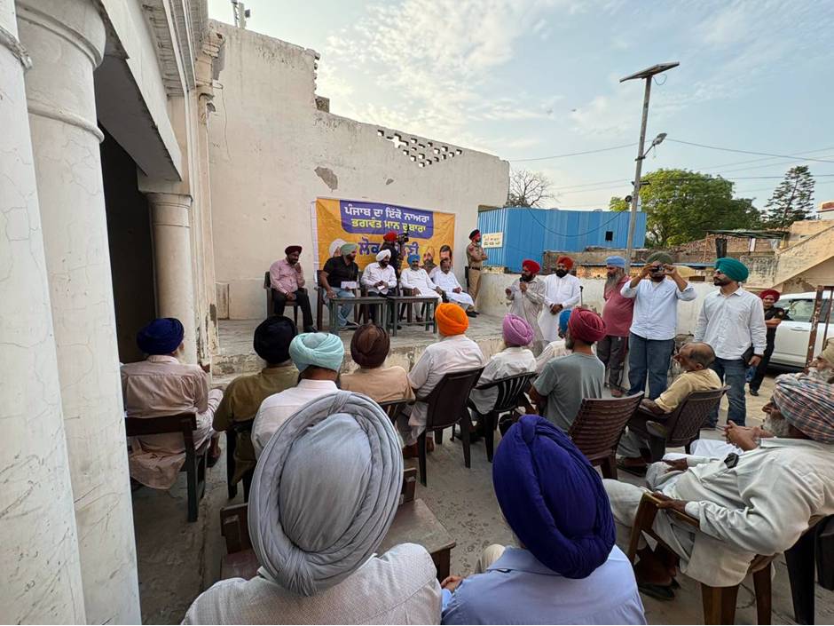 MLA Kulwant Singh interacting with residents during a community meeting in Manak Majra village, SAS Nagar Mohali, discussing development works and public welfare initiatives.