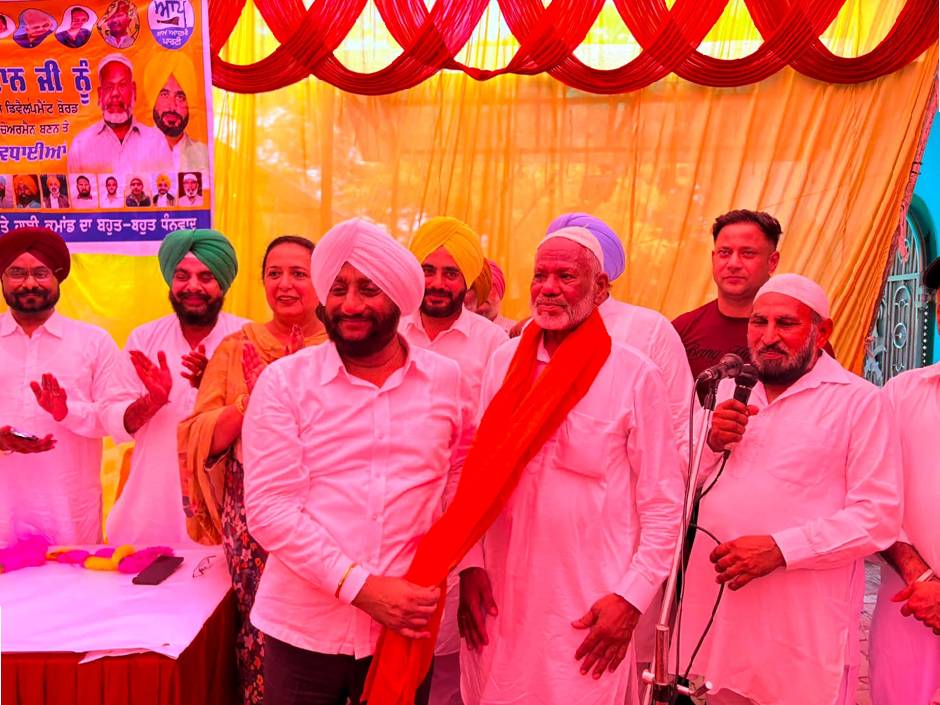 MLA Kulwant Singh congratulating Sodagar Khan during a thanksgiving ceremony following his appointment as Chairman of the Punjab State Muslim Development Board in Mohali.