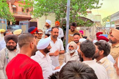 MLA Kulwant Singh interacting with residents during a community meeting in Sukhgarh village, SAS Nagar Mohali, discussing development projects and public welfare initiatives.