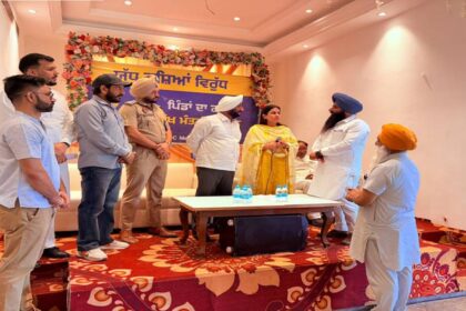 MLA Kulwant Singh distributing identity cards to War Against Drugs volunteers during a meeting in SAS Nagar Mohali to strengthen the anti-drug awareness campaign