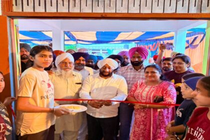 MLA Kulwant Singh inaugurating a new village gym during a Lok Milni programme in Gudana village, SAS Nagar Mohali, with local residents.