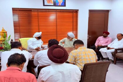 MLA Kulwant Singh interacting with residents during a public grievance meeting at his constituency office in Mohali.