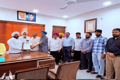 MLA Kulwant Singh interacting with residents during a public grievance meeting at his constituency office in Mohali.