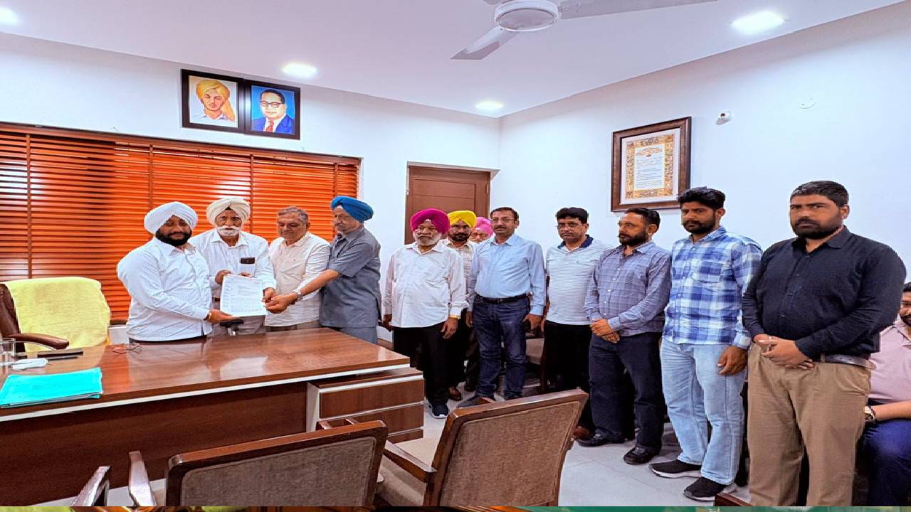 MLA Kulwant Singh interacting with residents during a public grievance meeting at his constituency office in Mohali.